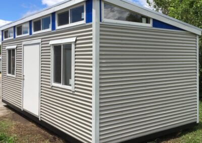 10x20 Modern Building Light Gray with White Trim and Blue Smart Board Transition. 4’ Door and Two 3’x3’ Double Pane Windows
